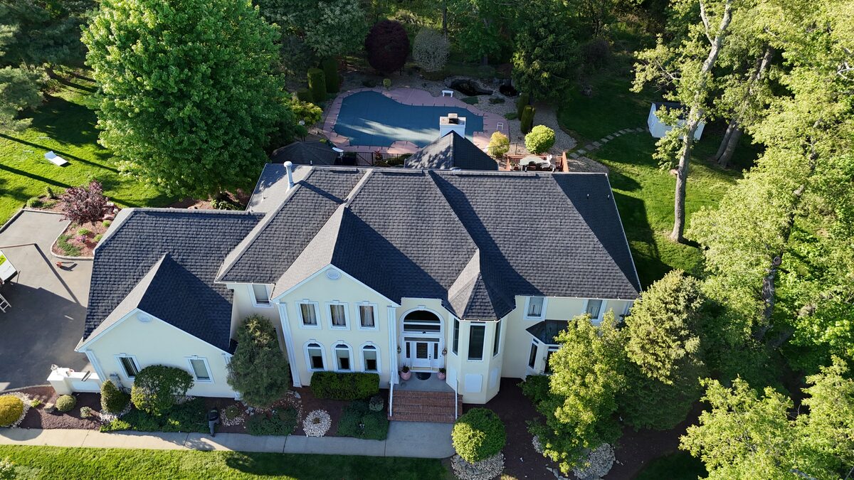 Aerial drone view of finished roof, wider angle